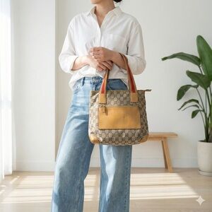 Vintage Gucci brown GG canvas tote with tan leather trim and red web straps